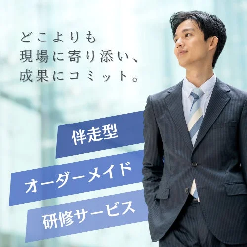 スーツ姿の若いビジネスマンが右方向を見つめている画像